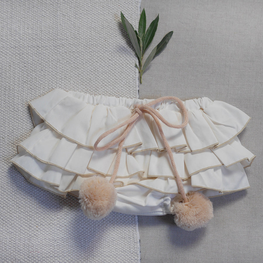 Baby bloomers with pom-poms